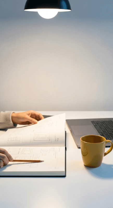 notebook and laptop on desk