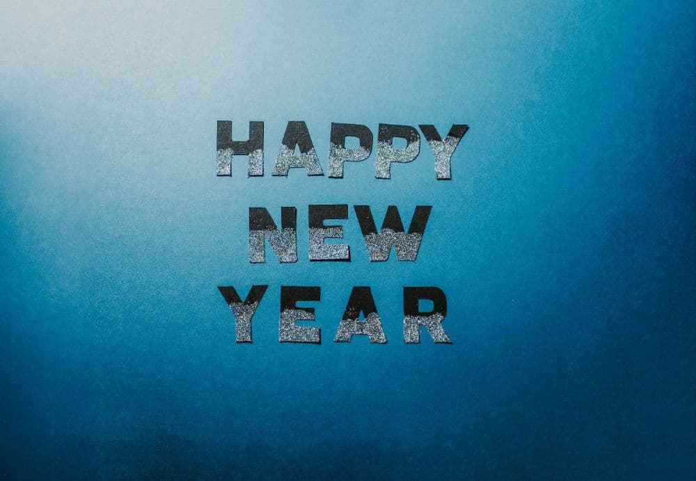 A black and white Illustration of a pie chart on a purple background