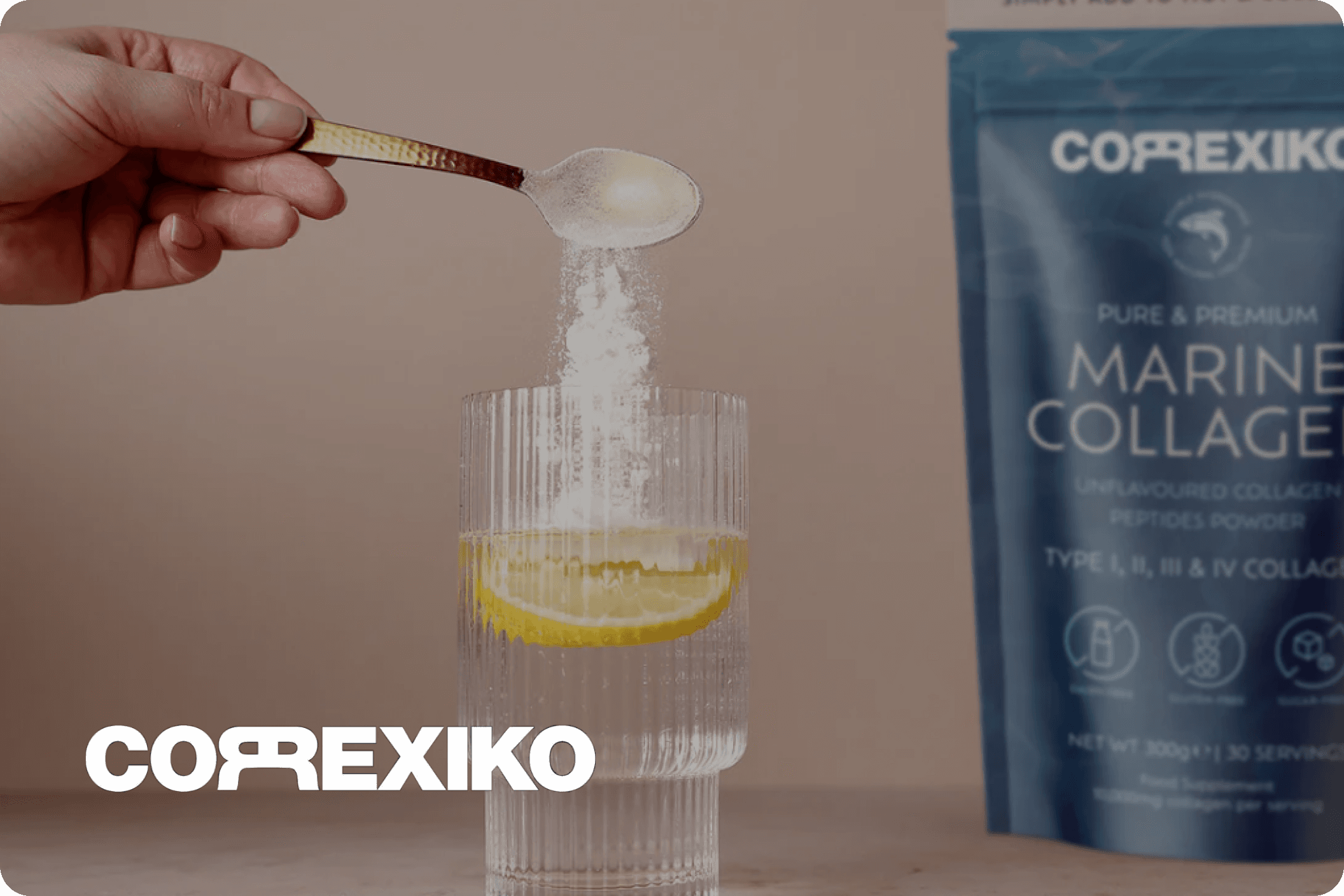 Someone mixing correxiko into a glass on the kitchen side